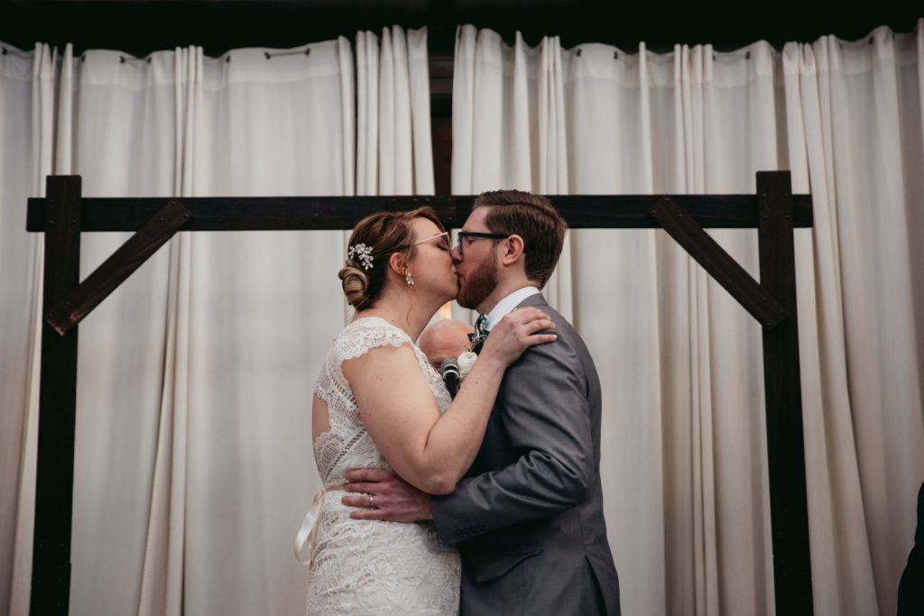 Bride and groom kissing