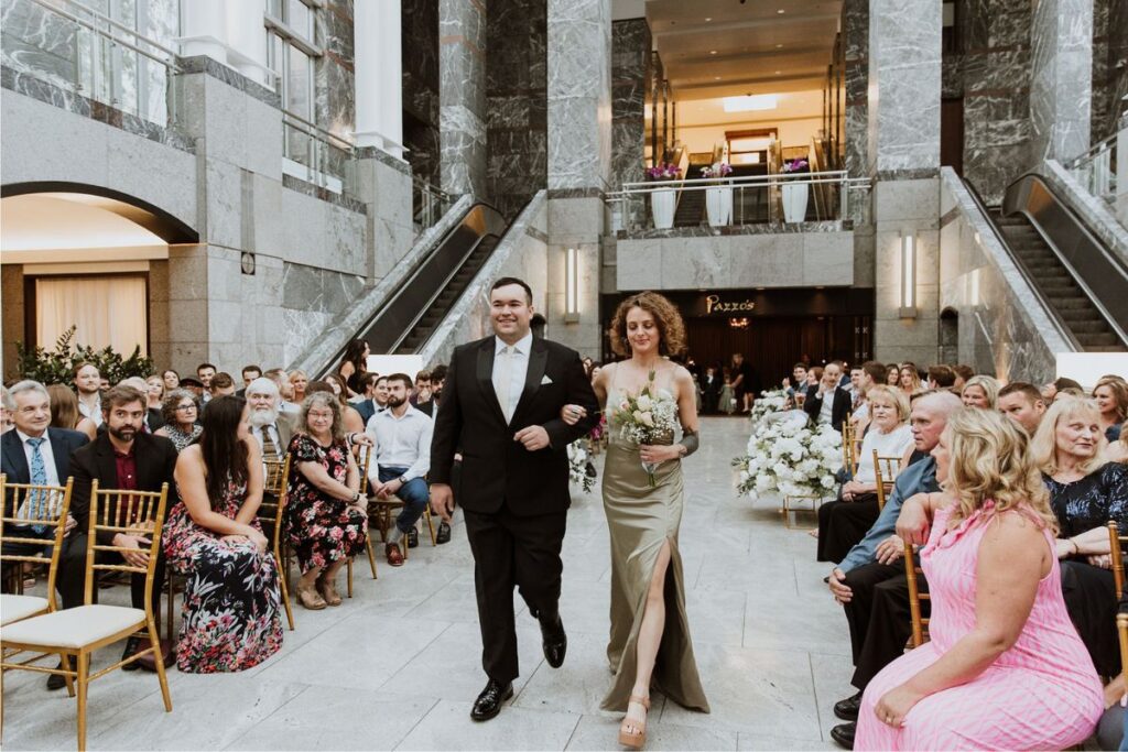 Bride and groom making their grand entrance into the wedding reception.
